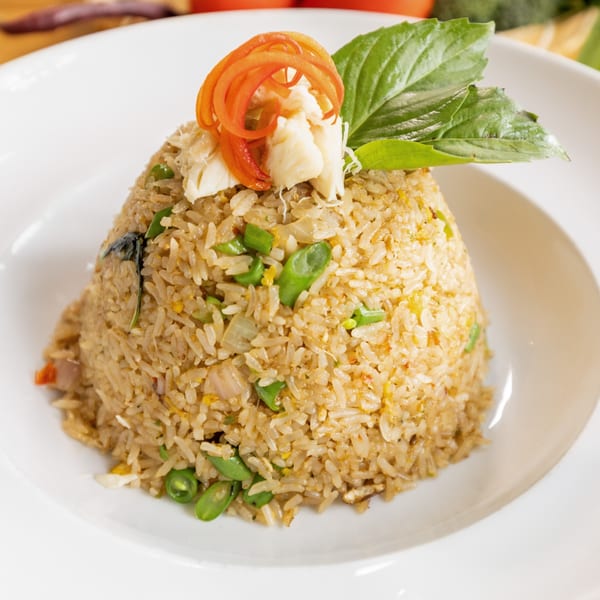 Colonial Kitchen and Bar's Thai crab fried rice, garnished with basil and shredded carrots.